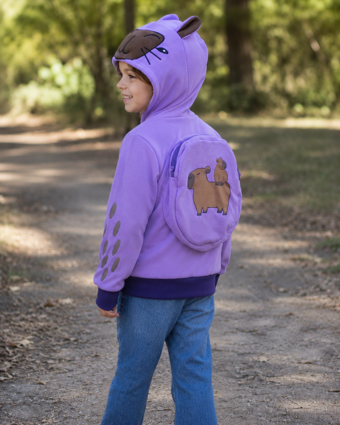 Child showing the Lavender Sky backpack hoodie from the back